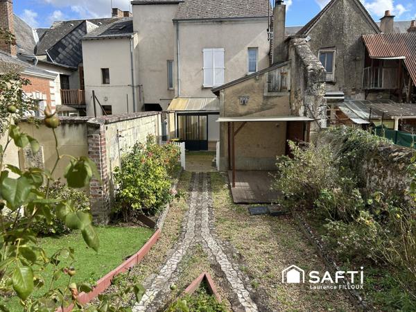 Maison de ville avec jardin et dépendance