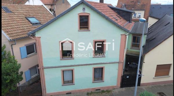 Maison sur trois niveaux dans une ruelle calme