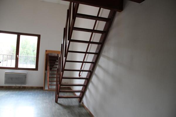 APPARTEMENT SUR 2 NIVEAUX AVEC EMPLACEMENT PARKING ET CAVE