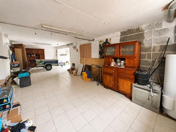 Maison avec grand garage, terrasse en impasse Chabossiere