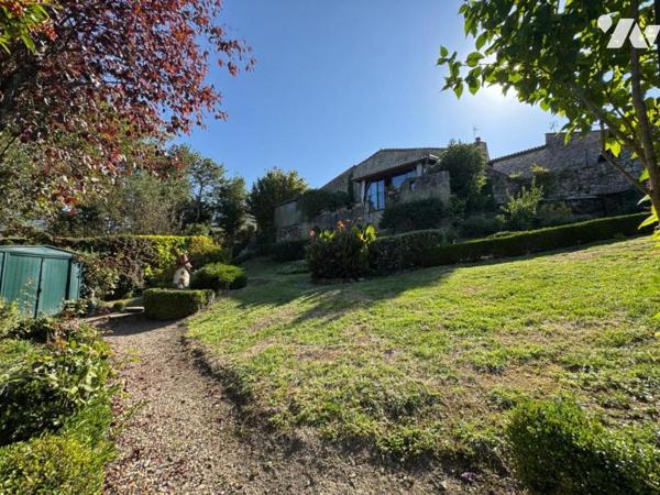 Au calme d'un hameau, habitation avec garage et jardin