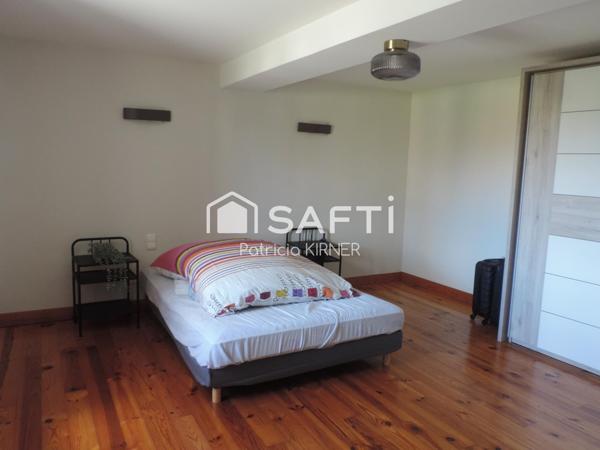 Maison de ville T5 avec garage, jardin et puits.