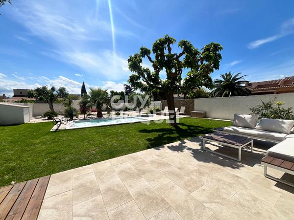 Maison d'Exception à Vendre à Théza - Un Havre de Paix et de Confort