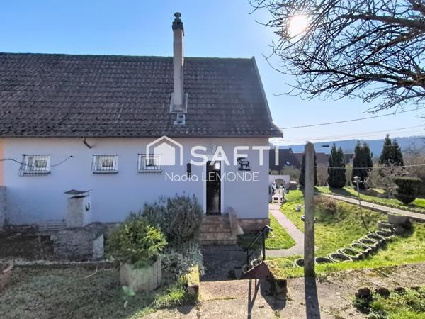Maison avec joli jardin, garage et dépendance, située au calme à Hombourg-Haut.