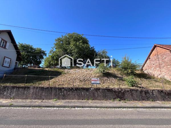 Vends terrain de construction au dessus de la route