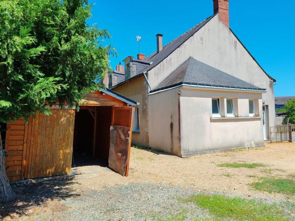 Opportunité ! Maison composée de deux logements en centre-ville, avec jardin, appentis et terrain.