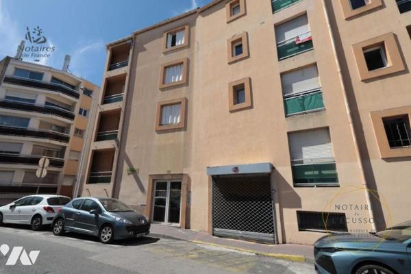 Place de parking en sous-sol avec cave
