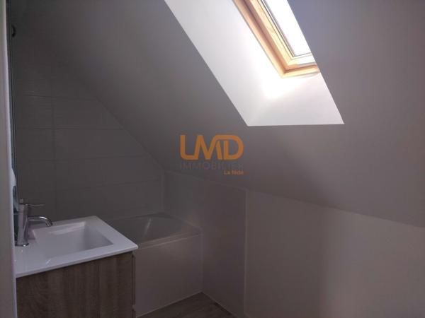 Immeuble de rapport rénové : 3 appartements + caves + garages + jardin