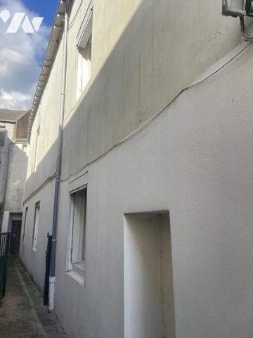 UN APPARTEMENT T3 + CAVE + JARDIN