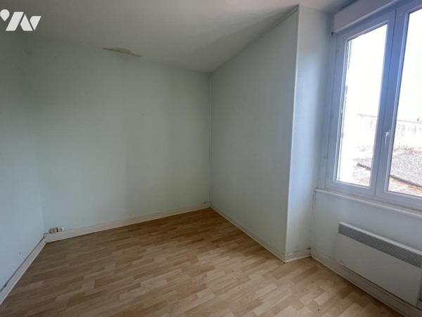 UN APPARTEMENT T3 + CAVE + JARDIN