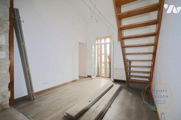 Appartement T2 avec mezzanine, jardinet et cave