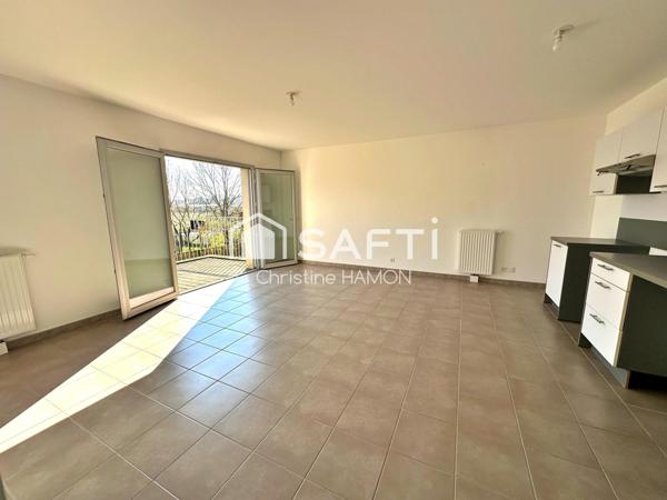 T3 balcon, parking couvert, cave à 500m de la gare