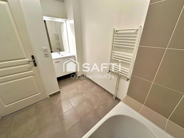 T3 balcon, parking couvert, cave à 500m de la gare