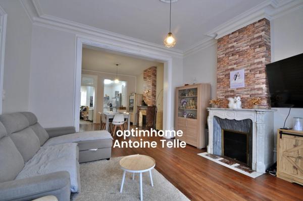 Maison semi-individuelle avec grand garage & jardin clos