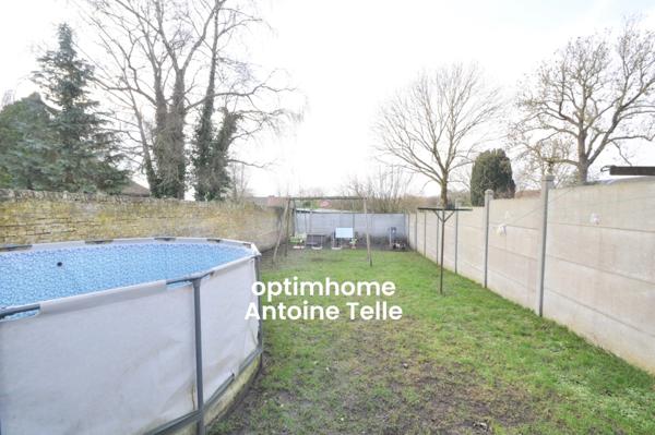 Maison semi-individuelle avec grand garage & jardin clos