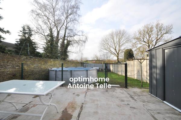 Maison semi-individuelle avec grand garage & jardin clos