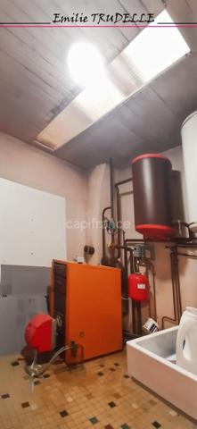 Maison à vendre 8 pièces SAINT CALAIS (72) Ensemble immobilier à fort potentiel : local commercial + appartement en duplex avec patio