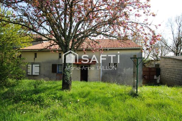 Maison à réinventer avec trois garages sur un terrain de 6 498 m2