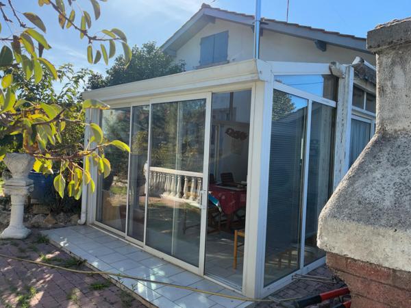 Lège bourg : maison 6 pièces de 123 m² avec véranda chauffée