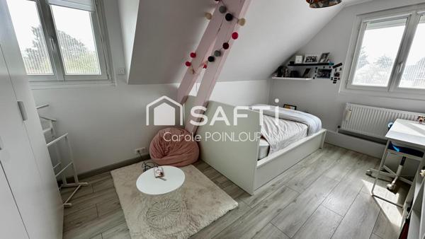 Maison individuelle dans un cadre verdoyant