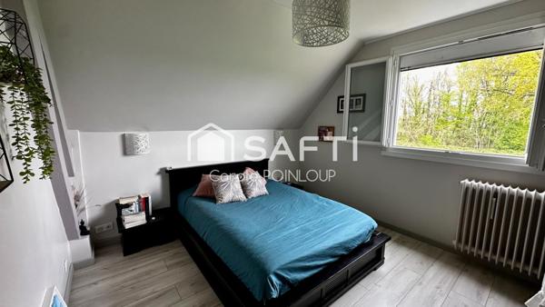 Maison individuelle dans un cadre verdoyant