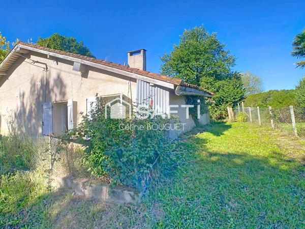 Maison à rénover avec garage et jardin