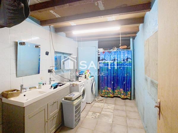 Maison à rénover avec garage et jardin