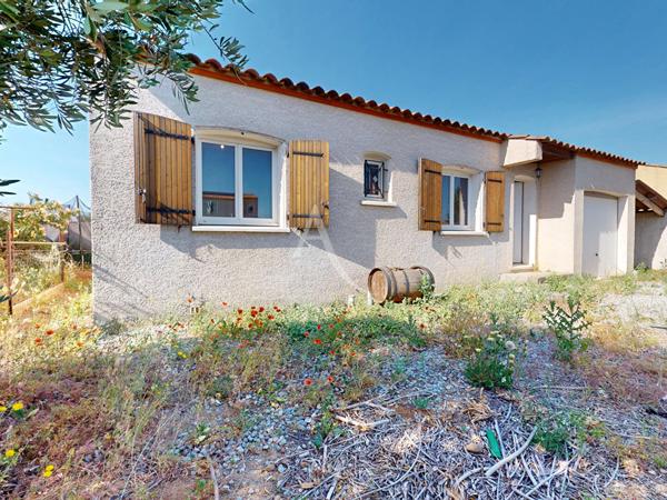 Maison 4 faces plain pied avec jardin et garage à Paraza