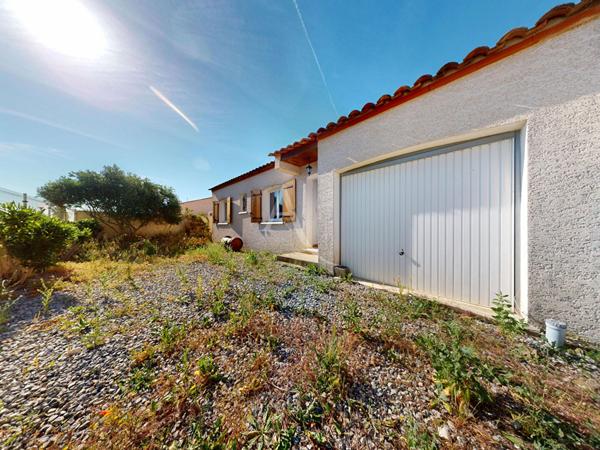 Maison 4 faces plain pied avec jardin et garage à Paraza