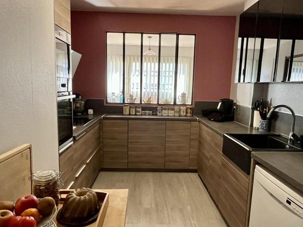 Appartement  de 111m², 3 chambres, balcon, 2 box et une cave