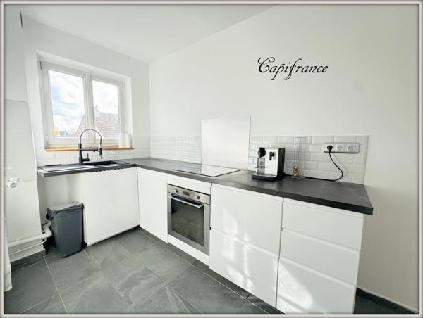 Appartement à vendre 2 pièces de 52 m² avec balcon + parking + cave . hyper centre