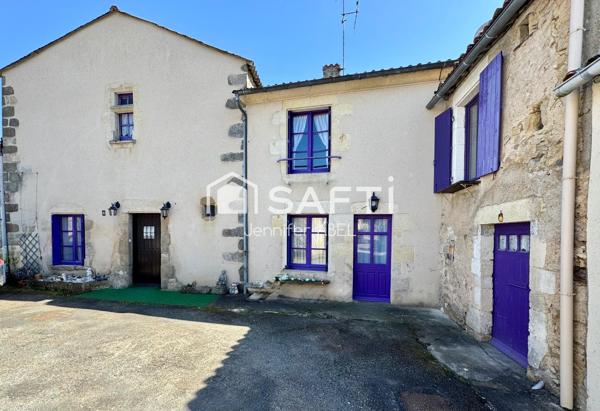 Maison de caractère de 220 m² au cœur de la cité médiévale de Saint-Loup-Lamairé avec studio indépendant, garage et dépendances.