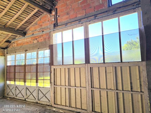Propriété à fort potentiel – Hangars & bâtiments – 450 m² exploitables sur 15 000 m² de terrain aménageable – Changement de destination possible