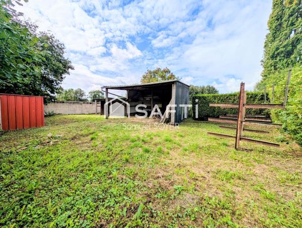 MAISON IND AVEC GARAGES ET JARDIN