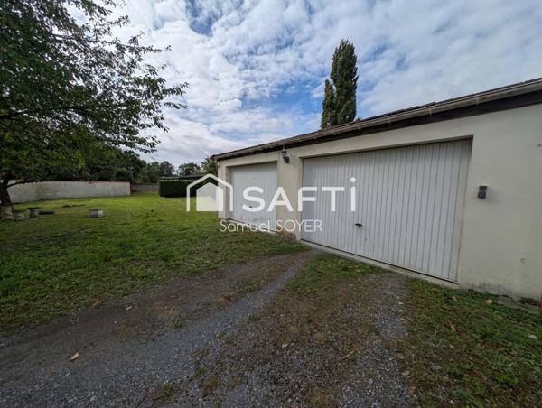 MAISON IND AVEC GARAGES ET JARDIN