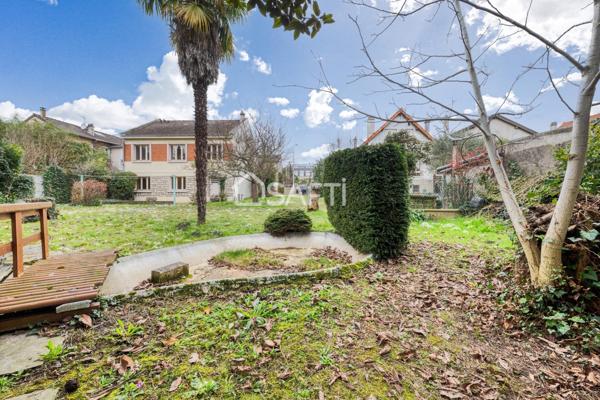 Maison familiale avec grand jardin arboré