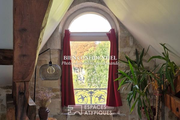 Appartement sous les toits en coeur de ville et sa charpente apparente