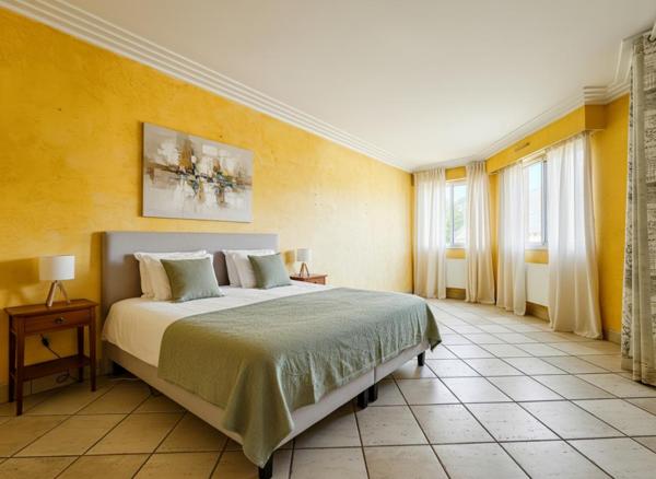 Appartement traversant avec 2 balcons et stationnement sous sol