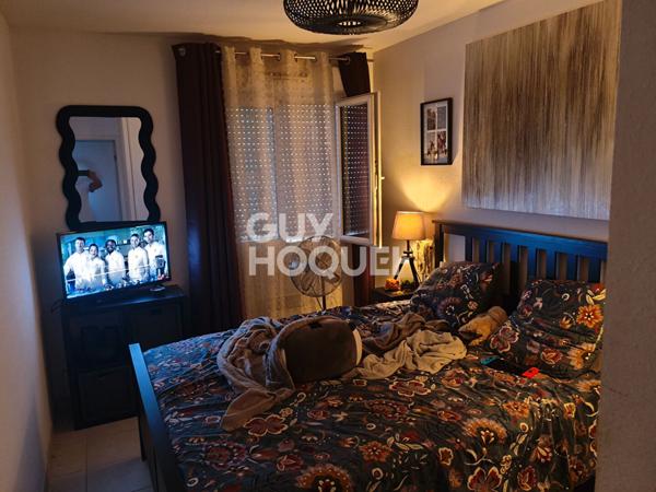 Appartement type 3 en rez-de-chaussée - 63 m² - balcon et stationnements dans résidence sécurisée -