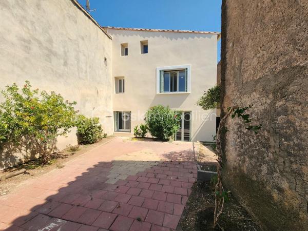 EN EXLUSIVITÉ

 Idéalement située à BESSAN à deux pas de toutes les commodités à pied,coup de cœur assuré pour cette magnifique maison de village traversante et très lumineuse de 130 m² habitables sur une parcelle totale de 219 m², entièrement rénovée à neuf du sol au plafond,

Seuls les murs d'origine ont été conservés : tout a été refait à neuf, de la façade jusqu'à l'intérieur (isolation, façade, planchers, toiture, électricité, plomberie...). 
 Pour une sérénité totale, la vente bénéficie d'une garantie décennale et d'une assurance dommage-ouvrage (fin de chantier tout juste réceptionnée).
Grâce à ses prestations énergétiques exceptionnelles, le bien affiche un DPE en A et des émissions de gaz à effet de serre en A.
Vous profitez ainsi du confort absolu d'un bien neuf doté d'une climatisation réversible dans toutes les pièces.

La disposition de la maison :

- Au rez-de-chaussée : Une superbe pièce de vie traversante de 46 m² baignée de lumière, comprenant une cuisine moderne entièrement neuve et équipée (avec tout son électroménager), ouverte sur un séjour-salle à manger,   avec un accès direct sur la cour ( conduit existant pour un poêle à bois ou poêle à granulés ) 
- Au 1er étage : Deux belles chambres de 14 m² et 16 m²( dont une avec un petit balcon), ainsi qu'une salle de bains de 7,50 m² avec WC.
- Au 2e étage : Deux autres chambres de 14 m² et 16 m² équipées de Velux motorisés ), accompagnées d'une salle d'eau de 7,40 m² avec WC.

Les extérieurs et les annexes :

- Une charmante cour extérieure sans aucun vis-à-vis, piscinable (sous réserve de l'accord de la mairie / déclaration préalable validée), et aménageable selon vos envies.
- Une remise de 24 m² électrifiée (idéale pour le stockage, un atelier ou autre).
- Un véritable luxe en centre-village : deux places de parking privatives (une première place extérieure située juste devant le portail, et une seconde place sécurisée à l'intérieur, après le portail).

La localisation :
Située à Bessan, village authentique et dynamique du Languedoc doté de tous les commerces et services de proximité accessibles à pied. Sa position géographique est idéale : à seulement quelques minutes de l'autoroute A9 et à peine 10-15 minutes des plages de la Méditerranée (Agde, Vias).

Une opportunité rare sur le marché, associant performances énergétiques de pointe, prestations domotiques et haut de gamme, et douceur de vivre du Sud.
N'hésitez pas à me contacter pour plus de renseignements.