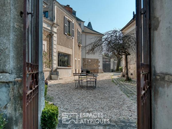 Maison de caractère en coeur de ville avec jardin et dépendances