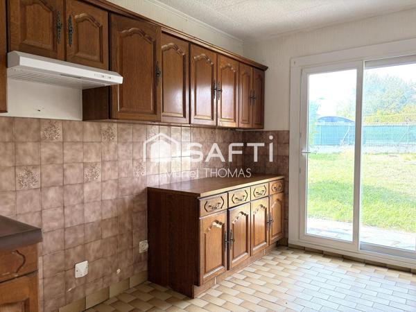 Maison de plain-pied avec 3 chambres et garage sur terrain de 520 m²