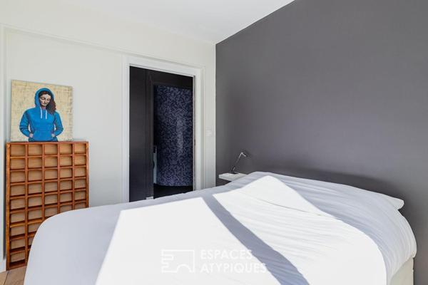 Appartement suspendu sur le parc des Buttes-Chaumont et la skyline parisienne