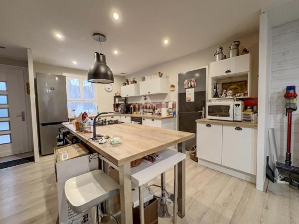 Maison 4 chambres - garage- atelier - jardin - beaux volumes de pièces de vie