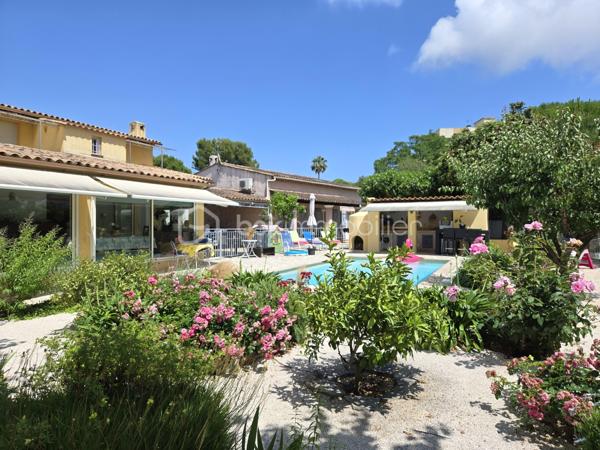 Découvrez cette magnifique propriété arborée et fleurie de 1559m², composée de deux maisons individuelles de 144m² et 166m² configurée en 3 habitations indépendantes et en parfait état à Antibes quartier les Combes. A quelques minutes de l'entrée de l'autoroute, de Sophia Antipolis, des commerces de proximité, des écoles, du cœur de ville et des transports en commun. La situation géographique est idéale. Nichée dans un cadre tranquille tout en étant en ville, idéale pour profiter d'une vie harmonieuse entre nature, confort urbain pour une vie de famille. 

Vous êtes d'abord charmé par l'état impeccable des maisons et des leurs extérieurs, l'importance donné à chaque détail, le ravissement de ce jardin tout en fleurs et très bien entretenu. 

La première maison est actuellement configurée en deux habitations distinctes :
-Un beau et grand 2 pièces de 87m² et de plain-pied comprenant une magnifique véranda de 24m² avec baie vitrée à galandage, face à la piscine et au jardin exposé sud. Un salon cocooning avec cheminée, poutres apparentes, plafond cathédrale, une cuisine haut de gamme est ouverte sur le salon, cette pièce de vie offre 35m². Une chambre et une salle d'eau avec toilette de plain pied complète cette première habitation.
-Un 3 pièces avec son entrée indépendante de 67m², lumineux et cosy avec salon et cuisine ouverte de 28m², un toilette invité. A l'étage, 2 belles chambres et chacune sa terrasse tropézienne donnant sur le jardin et la piscine. Une spacieuse salle d'eau avec toilette. 

L'ensemble immobilier est sécurisé par un portail électrique. Une cave, espace potager, des arbres fruitiers, espace pétanque, auvent pour plusieurs voitures, garage couvert, immense parking ne sont qu'une partie des dépendances et atout de cette propriété. 

La piscine 9m/4m dispose d'un pool house équipée avec four à pizza, lave vaisselle, point d'eau... une magnifique terrasse permet d'en profiter pour les soirée barbecues.  

La seconde maison est familiale et lumineuse de 166m² composée d'un volumineux salon avec cheminée et d'une cuisine ouverte de 46m². Deux chambres de plain pied, une salle d'eau et un toilette invité. Vous trouverez à l'étage mansardée 3 grandes chambres, un cellier, une salle de douche avec toilette. A l'extérieur, une grande terrasse, un espace dinatoire sous pergolas, un barbecue, la place ne manque pas. 

Les points d'attentions:
Léger vis à vis latérale avec l'immeuble en face

Les +
Climatisation dans l'ensemble des espaces habitables des deux maisons
Double vitrage 
Deux cheminées avec insert
Très nombreuses places de parkings
Beaucoup de potentiel avec les deux entrées indépendantes qui permet d'envisager des possibilités comme une très grande famille, la possibilité de louer une des maisons ou d'en revendre une après division établit par un géomètre etc...
Baies vitrées anti effraction
Agrandissement possible 

Curieux et pas sérieux s'abstenir, merci.
Contactez DANY DE LA CELLE pour plus d'informations.