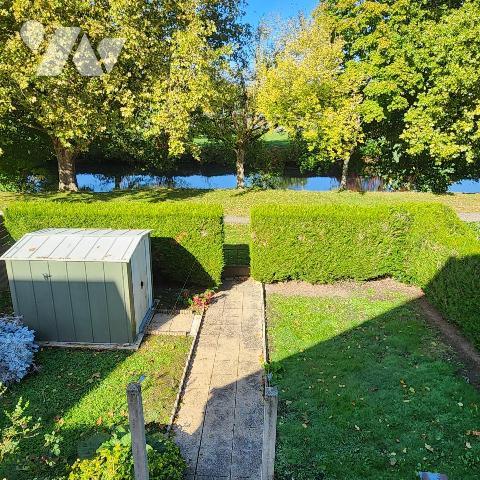 Charmante maison mitoyenne avec jardin et garage 
