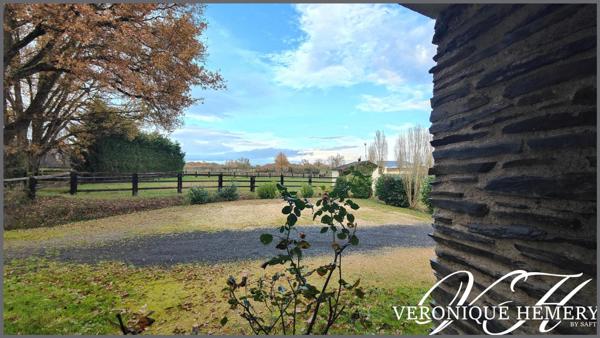 Superbe environnement pour cette maison 4 chambres avec grand garage