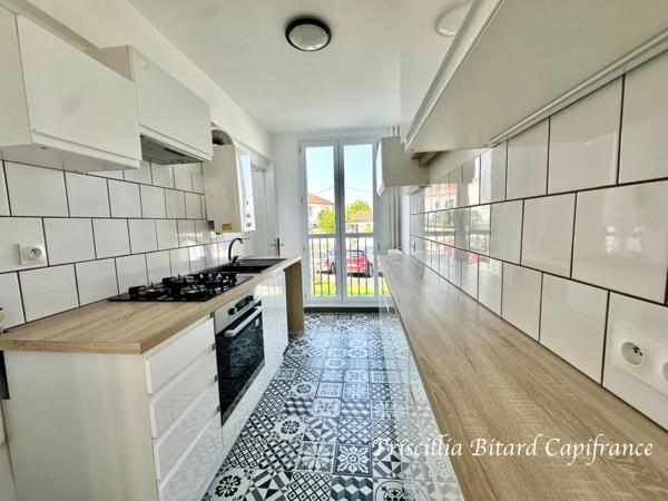 Appartement T4 en rez-de-chaussée avec jardin privatif et cave