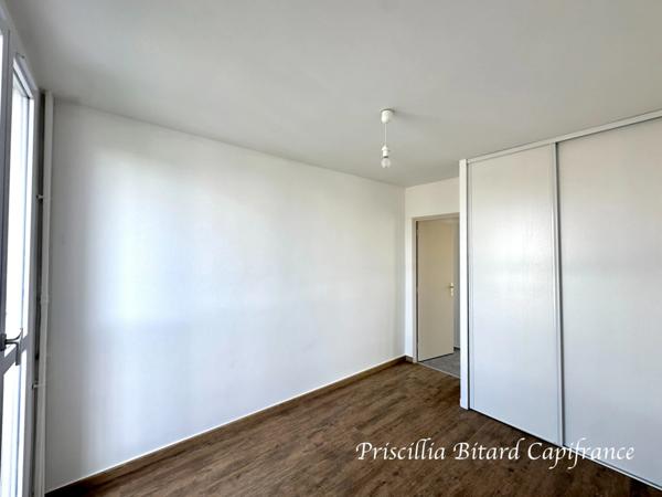 Appartement T4 en rez-de-chaussée avec jardin privatif et cave