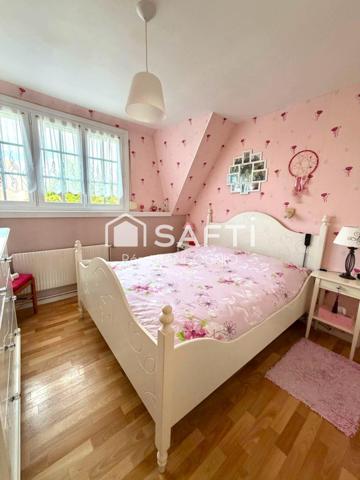 Maison 94 M2 avec 3 chambres, garage et jardin.